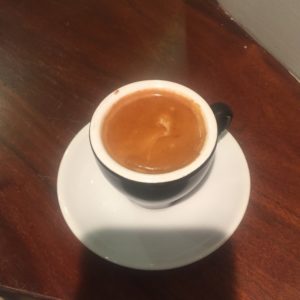 Macchiato lacking latte art.